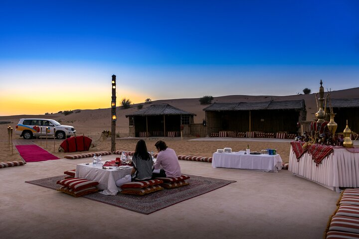 Experience serene moments in the desert with a cozy BBQ dinner as sunsets illuminate the dunes followed by a night of stargazing under a blanket of twinkling stars.